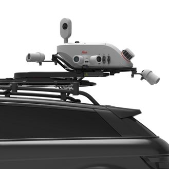 Leica Pegasus TRK with full camera system mounted on a vehicle roof, integrating multiple sensors for a 120MP integral view with add-on front, side, and pavement cameras, showcasing SmartFusion technology.